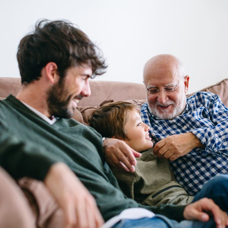family sitting on couch family sitting on couch